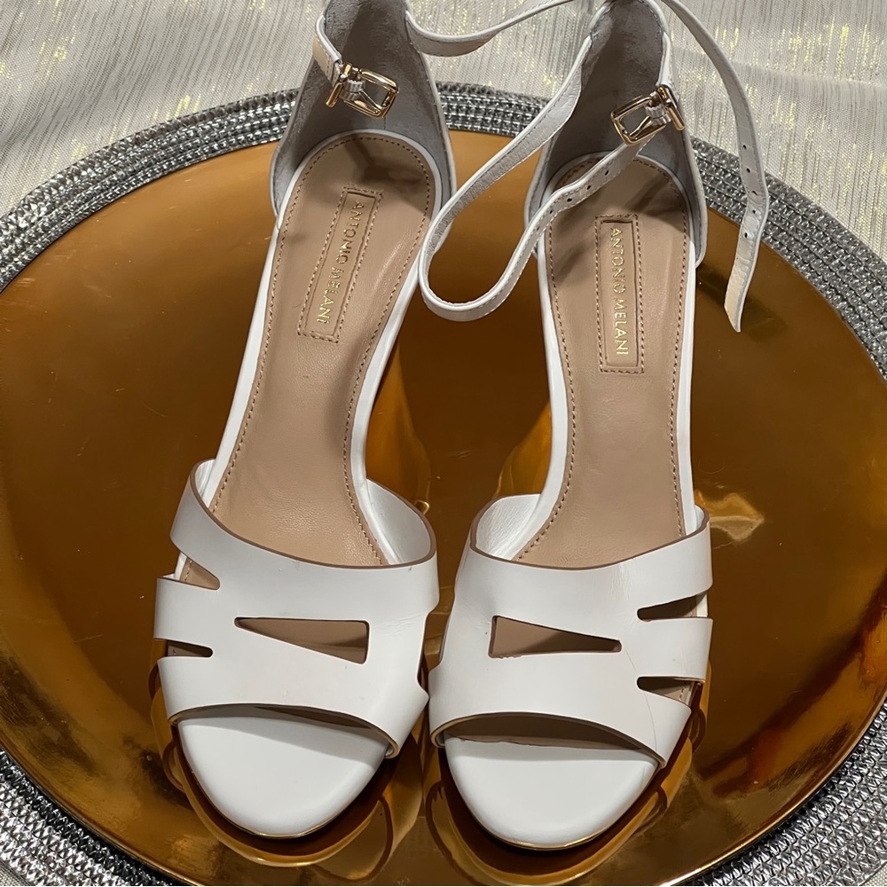 Brand new and never worn off-white, size 7, ANTONIO MELANI wedge heels.